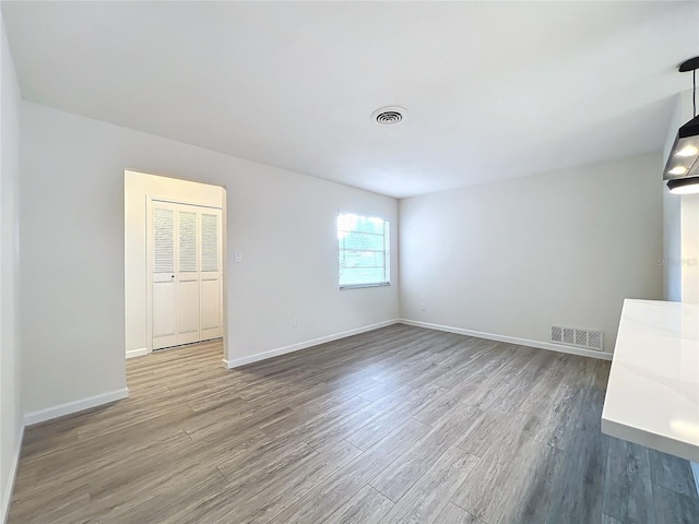 empty room featuring hardwood / wood-style floors