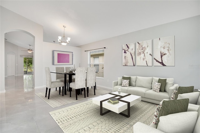 living room with ceiling fan with notable chandelier