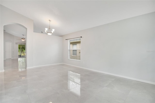 empty room featuring ceiling fan with notable chandelier