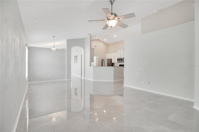 spare room featuring ceiling fan and lofted ceiling