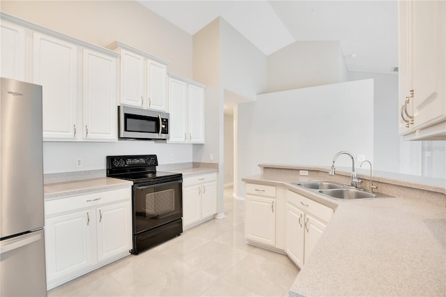 kitchen with sink, white cabinets, high vaulted ceiling, appliances with stainless steel finishes, and light tile patterned floors