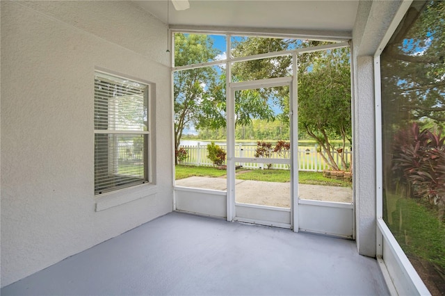 unfurnished sunroom with vaulted ceiling and plenty of natural light