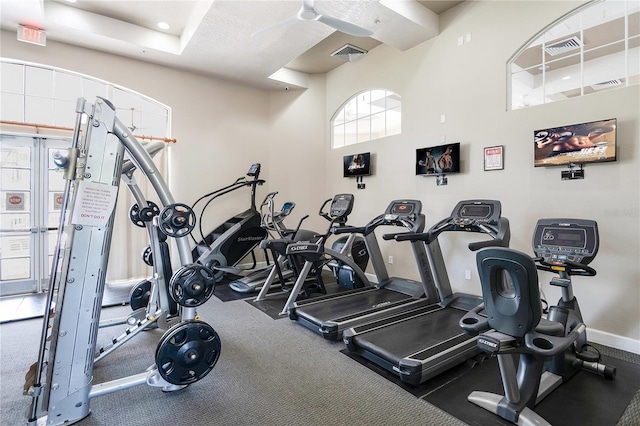 gym featuring a high ceiling