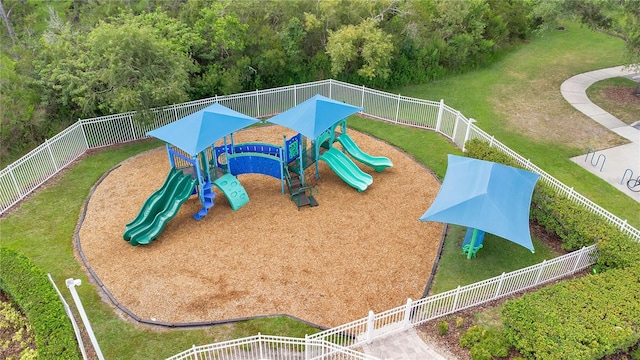 view of jungle gym with a lawn