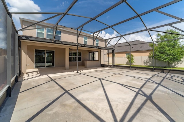 exterior space featuring ceiling fan, stucco siding, a lanai, and a patio area