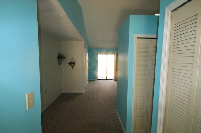 hall with dark carpet