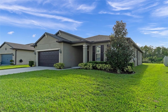 view of front of property featuring a garage and a front lawn