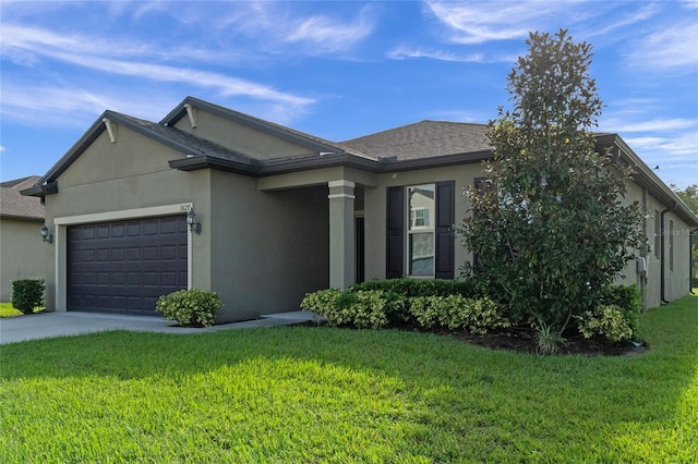 view of front of property with a garage and a front lawn