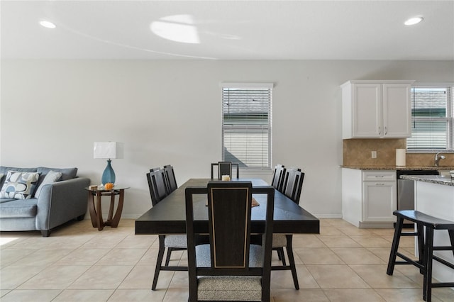 dining space featuring light tile patterned floors