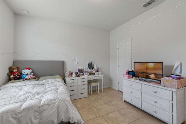 bedroom featuring light tile patterned floors