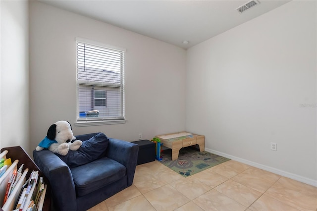 sitting room featuring light tile patterned floors