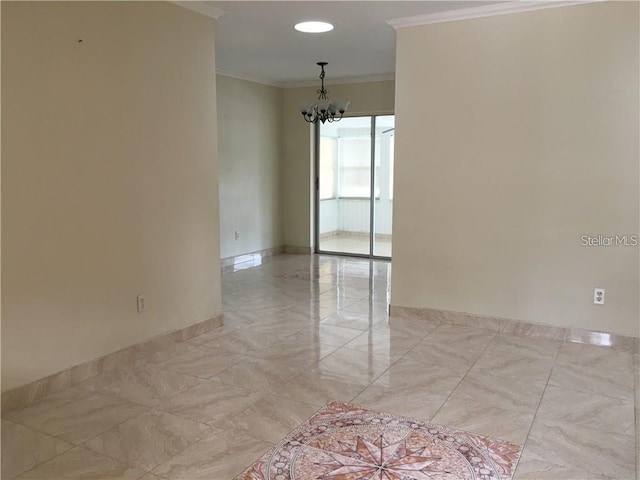 empty room featuring a notable chandelier and crown molding