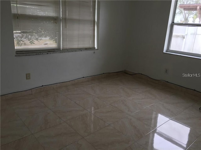 spare room with a wealth of natural light