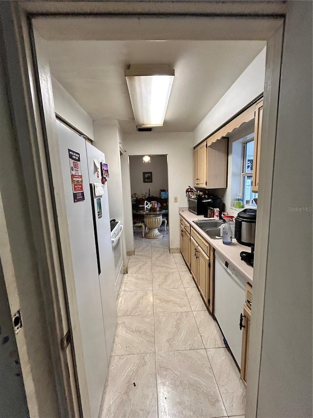 kitchen with white appliances and sink