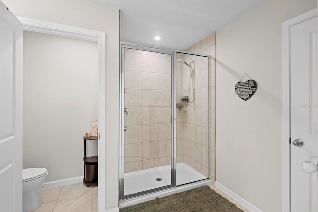 1820 Holden Ridge Ln, Clermont, FL 34715 - full bath featuring tile patterned floors, toilet, baseboards, and a stall shower