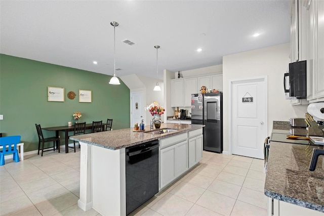 1820 Holden Ridge Ln, Clermont, FL 34715 - kitchen with visible vents, dark stone counters, white cabinets, black appliances, and a sink
