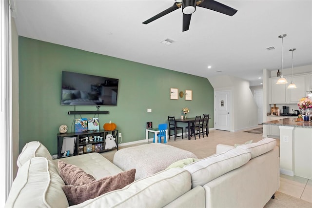 1820 Holden Ridge Ln, Clermont, FL 34715 - living room featuring visible vents, baseboards, light tile patterned flooring, and a ceiling fan