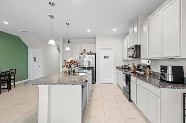 1820 Holden Ridge Ln, Clermont, FL 34715 - kitchen featuring visible vents, black appliances, recessed lighting, dark stone counters, and light tile patterned floors