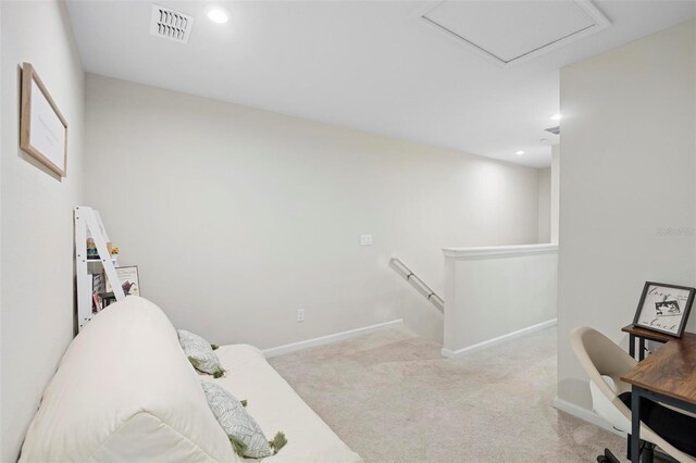 bedroom featuring light colored carpet