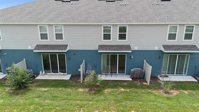 1820 Holden Ridge Ln, Clermont, FL 34715 - back of property featuring a patio area, stucco siding, a yard, and roof with shingles