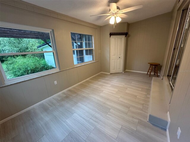 spare room with ceiling fan and light hardwood / wood-style floors