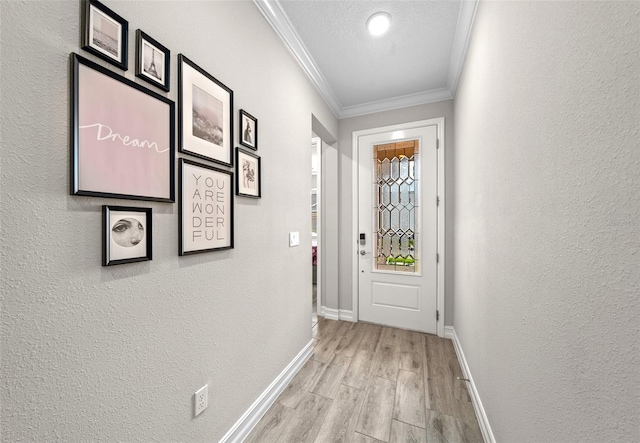 doorway to outside featuring light wood-type flooring, crown molding, and a textured ceiling