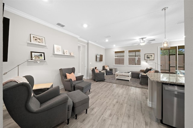 living room with ceiling fan, ornamental molding, and light wood-type flooring