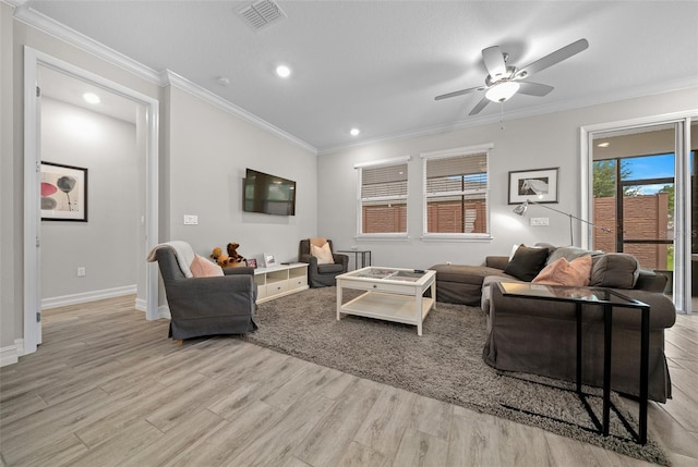 living room featuring ceiling fan, light hardwood / wood-style floors, and ornamental molding