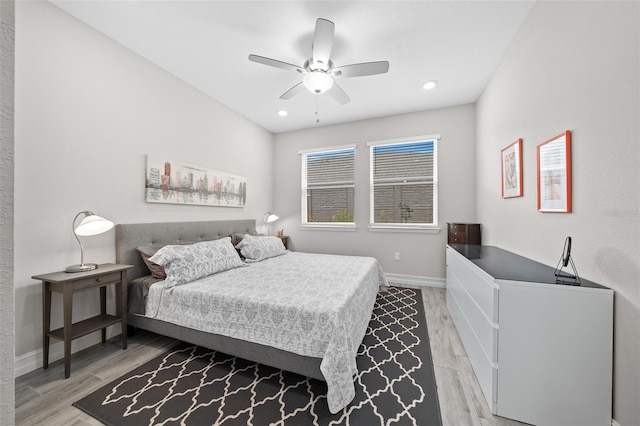 bedroom with ceiling fan and light wood-type flooring