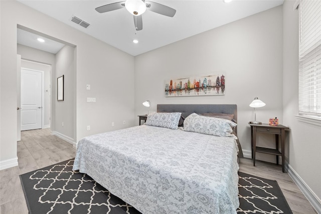 bedroom featuring ceiling fan and light hardwood / wood-style flooring