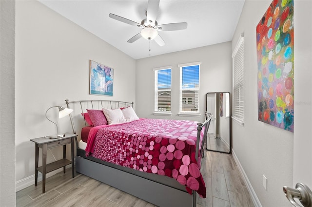 bedroom featuring light wood-type flooring and ceiling fan