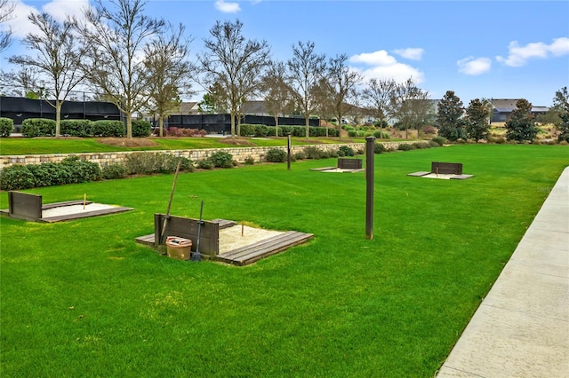 view of community featuring a yard