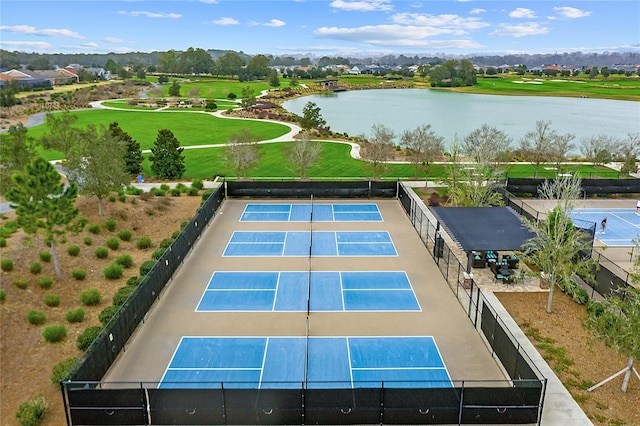 birds eye view of property with a water view