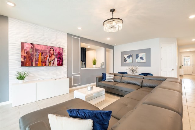 tiled living room with a notable chandelier