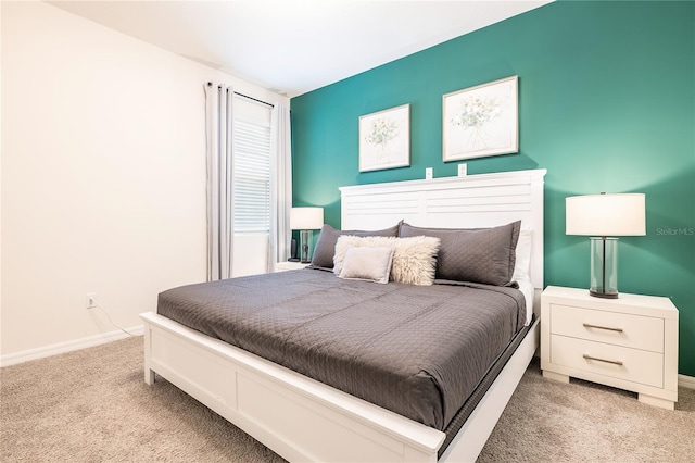 bedroom with light colored carpet