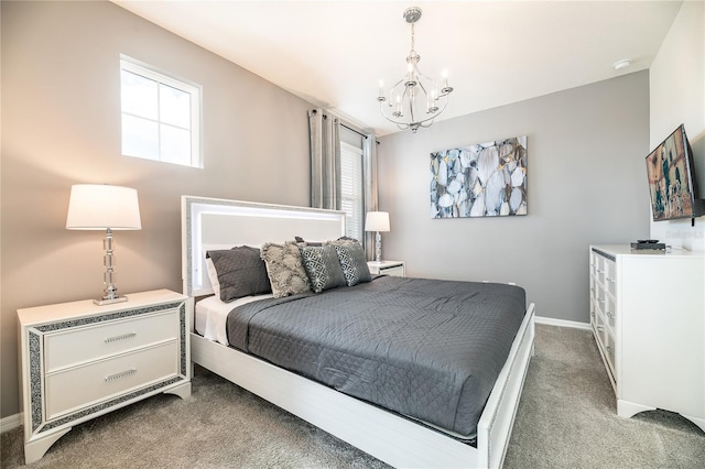 bedroom featuring dark colored carpet and a chandelier