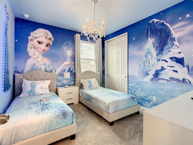 carpeted bedroom featuring a closet and a chandelier