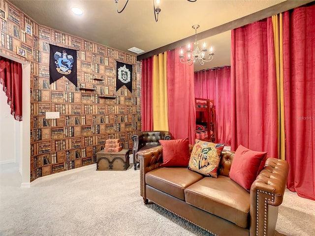 sitting room featuring a notable chandelier and carpet