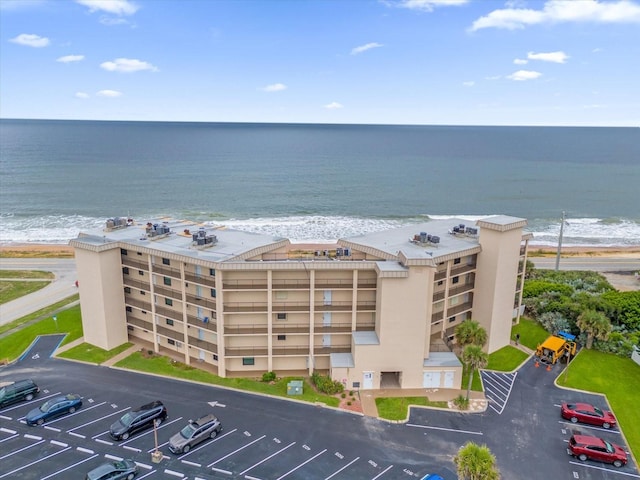 drone / aerial view with a view of the beach and a water view