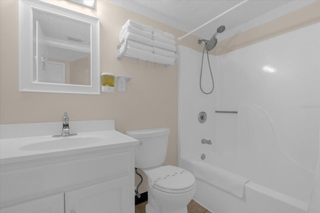 full bathroom with toilet, washtub / shower combination, a textured ceiling, and vanity