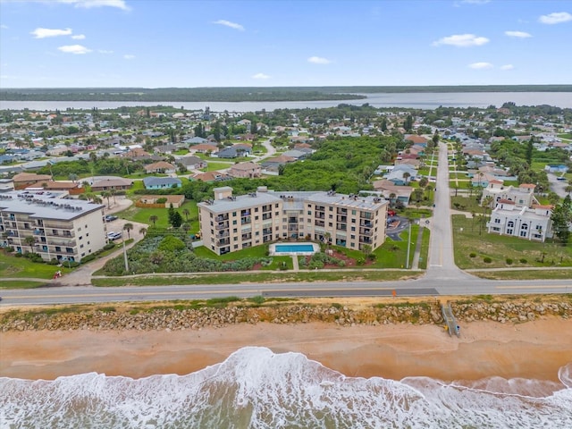 drone / aerial view with a view of the beach and a water view