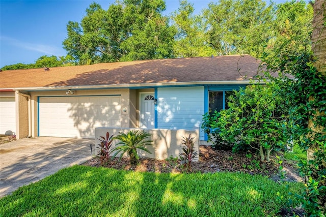 ranch-style home with a garage