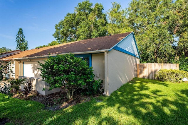 108 Clear Lake Cir, Sanford, FL 32773 - view of side of property with stucco siding, fence, and a yard