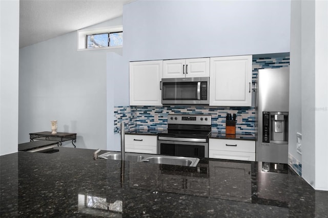 108 Clear Lake Cir, Sanford, FL 32773 - kitchen featuring a sink, vaulted ceiling, stainless steel appliances, and tasteful backsplash