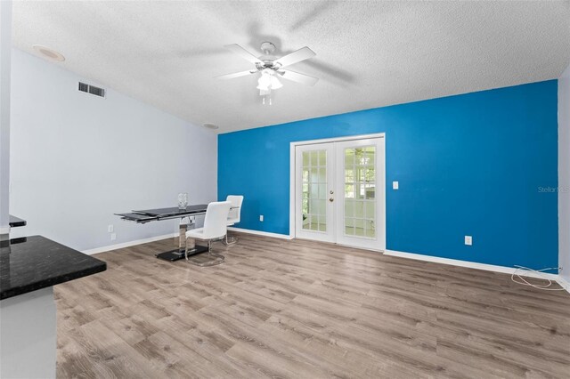 108 Clear Lake Cir, Sanford, FL 32773 - unfurnished office featuring french doors, a textured ceiling, visible vents, a ceiling fan, and wood finished floors