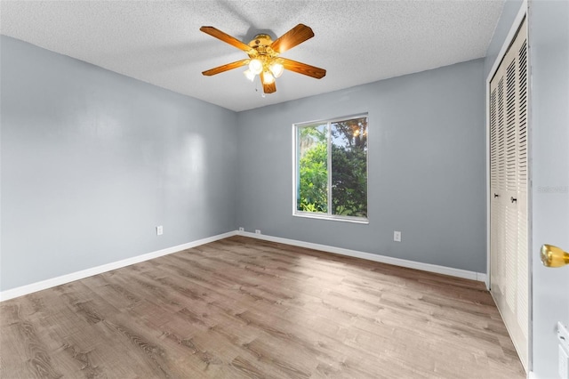 108 Clear Lake Cir, Sanford, FL 32773 - unfurnished bedroom featuring baseboards, a closet, and wood finished floors