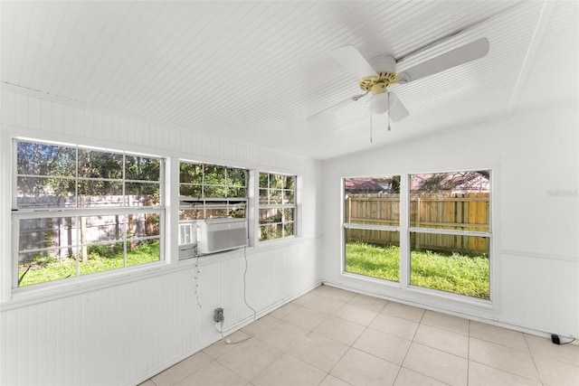 unfurnished sunroom with a healthy amount of sunlight and ceiling fan