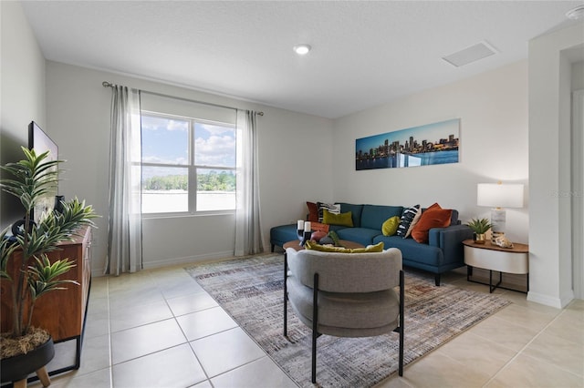 living room featuring light tile patterned flooring