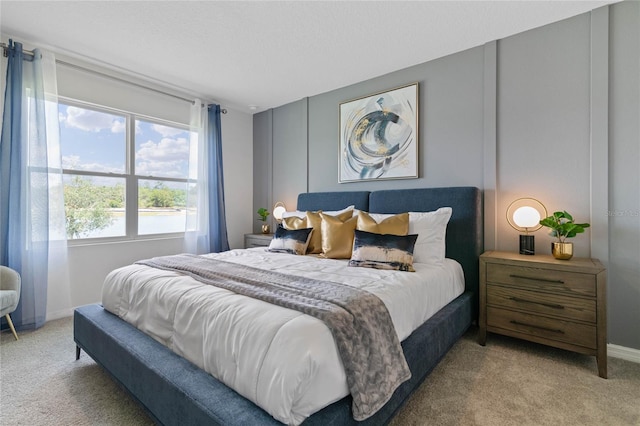 bedroom featuring light colored carpet