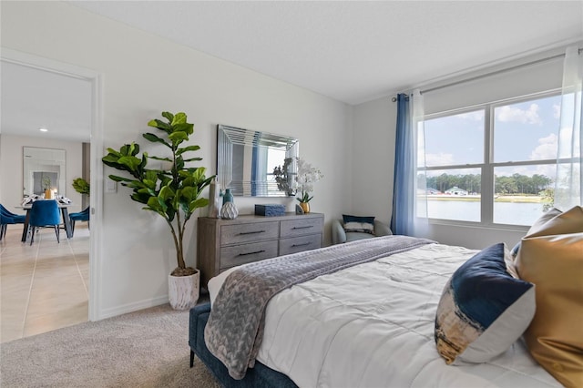 tiled bedroom with multiple windows